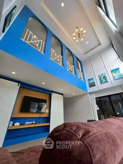 Stunning two-story living room with high ceilings and modern decor