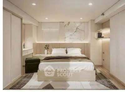 Modern bedroom with elegant decor and ambient lighting, featuring a cozy bed and stylish furnishings.