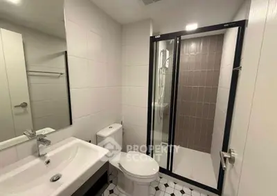 Modern bathroom with sleek shower enclosure and stylish fixtures