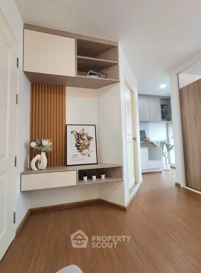Modern interior with stylish shelving and wooden flooring in a cozy living space.