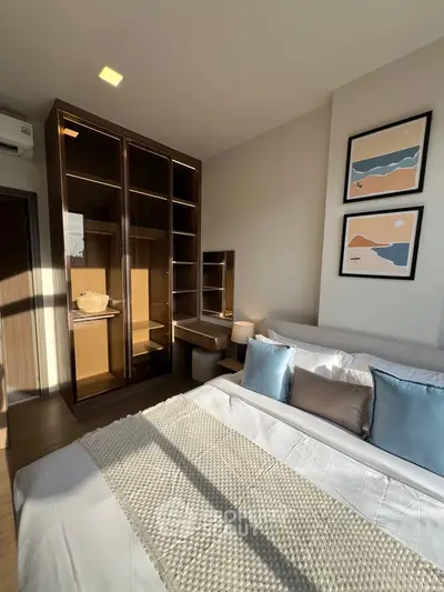 Modern bedroom with stylish decor and ample natural light