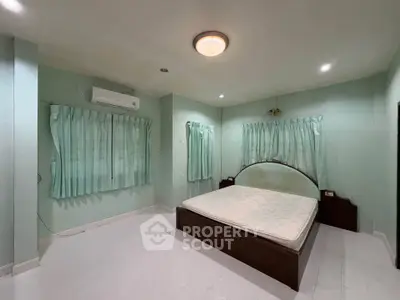 Spacious bedroom with minimalist design and natural light