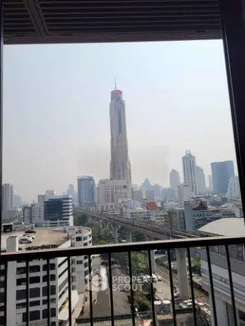Stunning cityscape view from a high-rise balcony overlooking urban skyline.