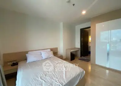 Spacious bedroom with modern design and ample natural light