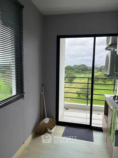 Charming balcony with lush green view, perfect for relaxation and enjoying nature's beauty.