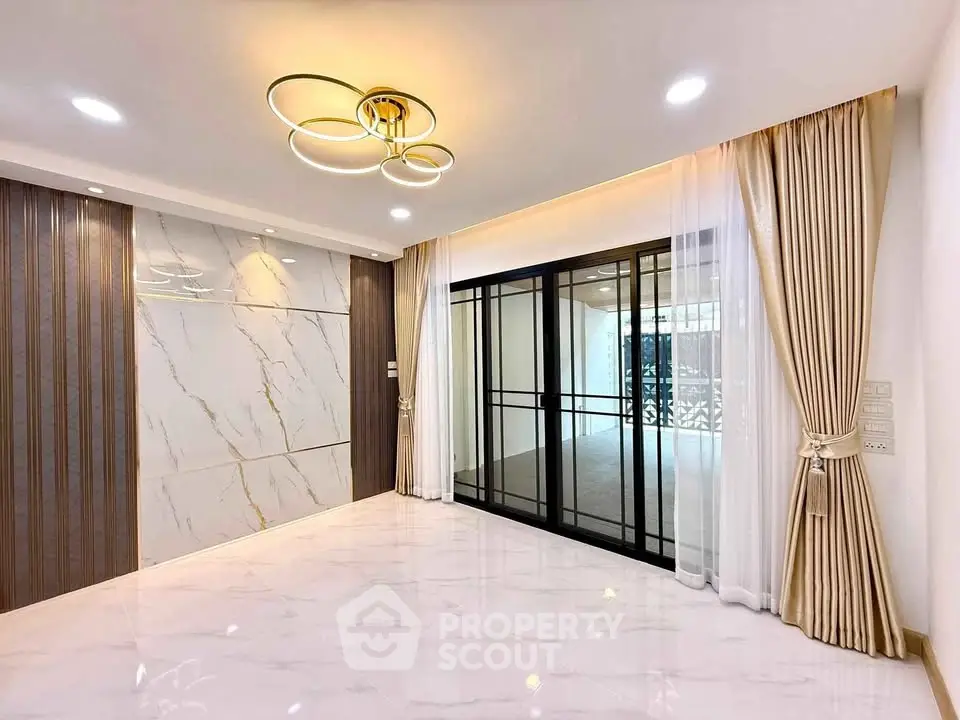 Elegant living room with marble accents and modern lighting