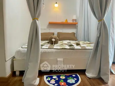 Cozy bedroom with elegant curtains and stylish decor, perfect for relaxation and comfort.
