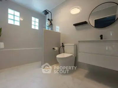 Modern bathroom with sleek fixtures and elegant lighting
