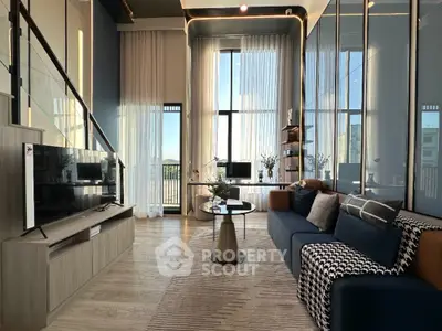Luxurious modern living room with high ceilings and elegant decor