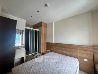 Modern bedroom with wooden accents and city view, featuring a comfortable bed and mirrored wardrobe.