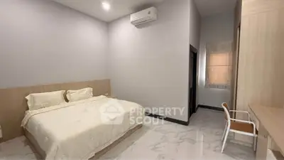 Spacious bedroom with modern design and air conditioning