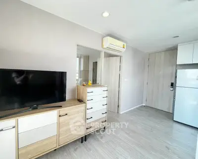 Modern living room with sleek furniture and air conditioning in a stylish apartment.