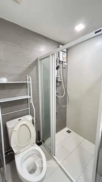 Modern bathroom with shower and toilet in sleek design
