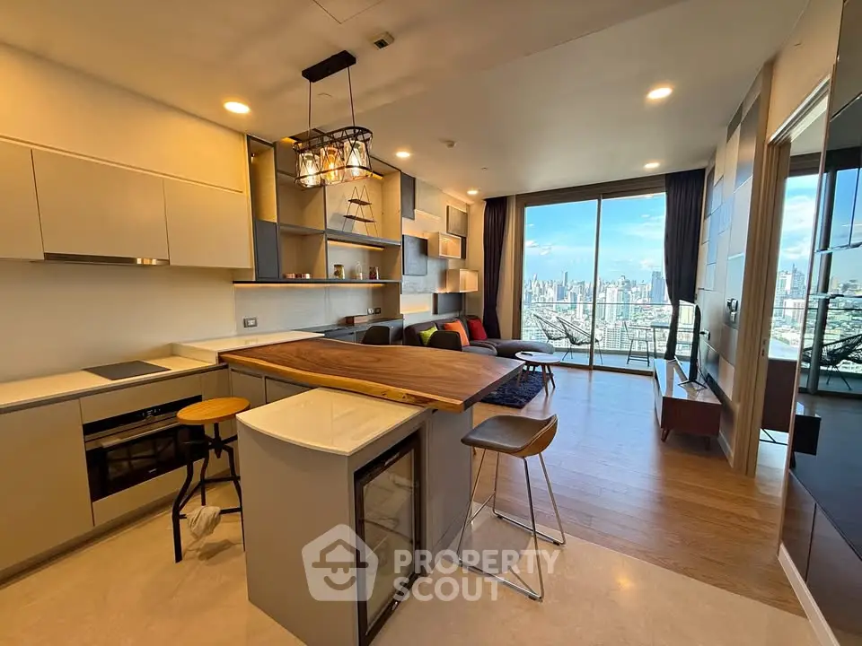 Modern open-layout kitchen and living room with stunning city view