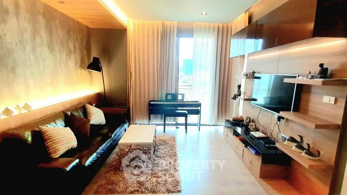 Stylish modern living room with piano and entertainment center, featuring cozy lighting and elegant decor.