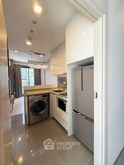 Modern kitchen with sleek appliances and open layout in a stylish apartment