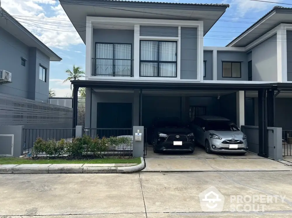 Modern two-story house with double garage and sleek exterior design