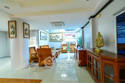 Spacious living room with elegant wooden furniture and bright natural lighting