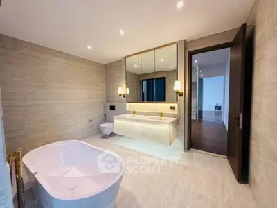 Luxurious modern bathroom with elegant bathtub and stylish lighting