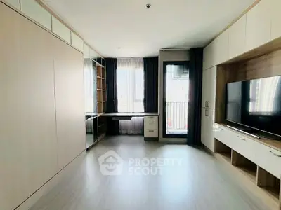 Spacious modern living room with built-in storage and large windows