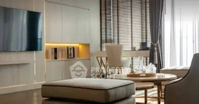 Modern living room with sleek furniture and large TV, perfect for stylish urban living.