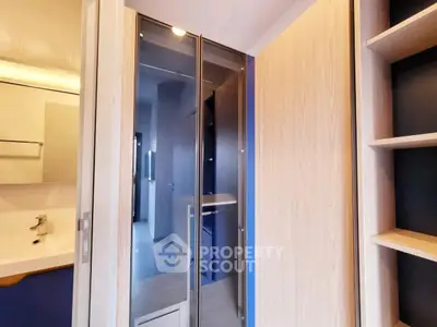 Modern bathroom with sleek glass shower and wooden accents