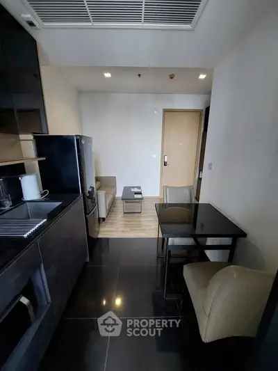 Modern apartment interior with sleek kitchen and cozy living area