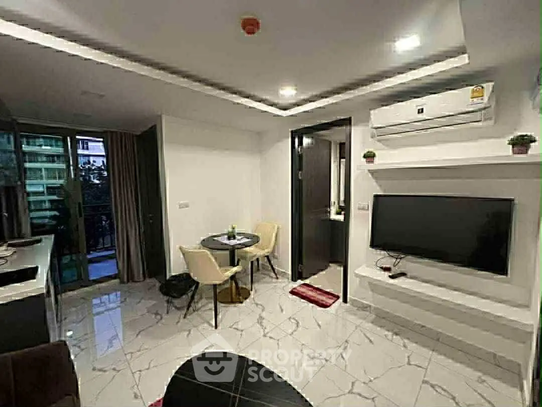 Modern living room with sleek design and balcony view