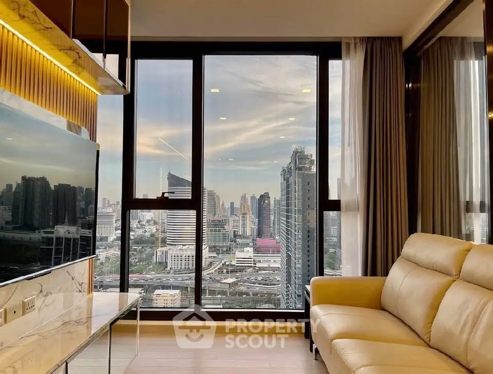 Luxurious living room with stunning city skyline view through large windows.