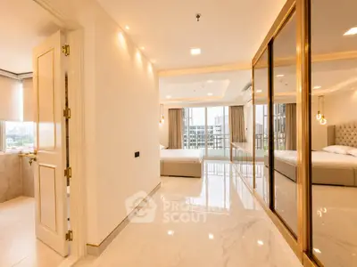 Luxurious modern bedroom with marble flooring and large windows offering city views.