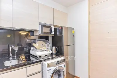 Modern kitchen with sleek appliances and ample storage space