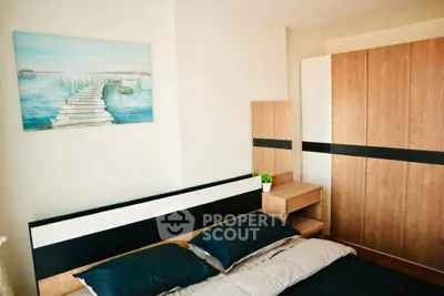 Modern bedroom with stylish wooden wardrobe and serene wall art