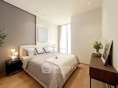 Elegant bedroom with modern decor and natural light, featuring a cozy bed and stylish furnishings.
