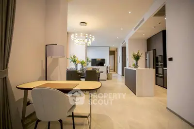 Luxurious open-plan living room with modern kitchen and elegant dining area.