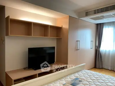 Modern bedroom with built-in storage and natural light
