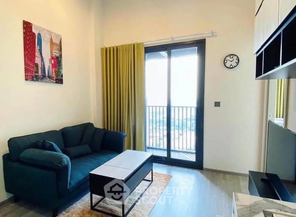 Modern living room with balcony view, stylish decor, and cozy seating area.