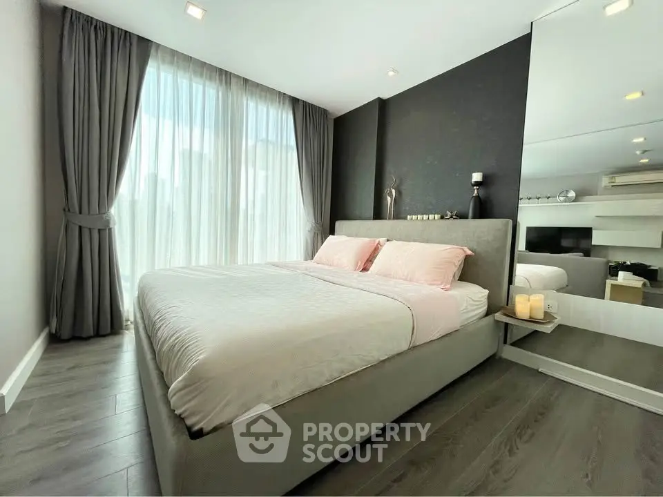 Luxurious modern bedroom with large windows and elegant decor