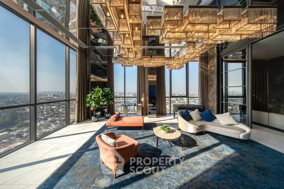 Luxurious high-rise living room with panoramic city views and elegant modern decor.
