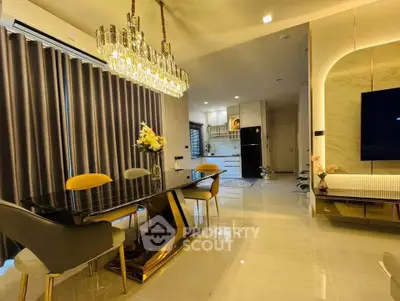 Luxurious modern living room with elegant chandelier and stylish dining area
