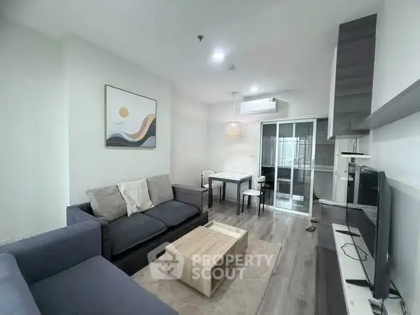 Modern living room with stylish furniture and open kitchen layout
