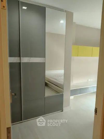 Modern bedroom with sleek wardrobe and minimalist design