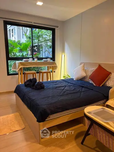 Cozy bedroom with garden view and stylish decor