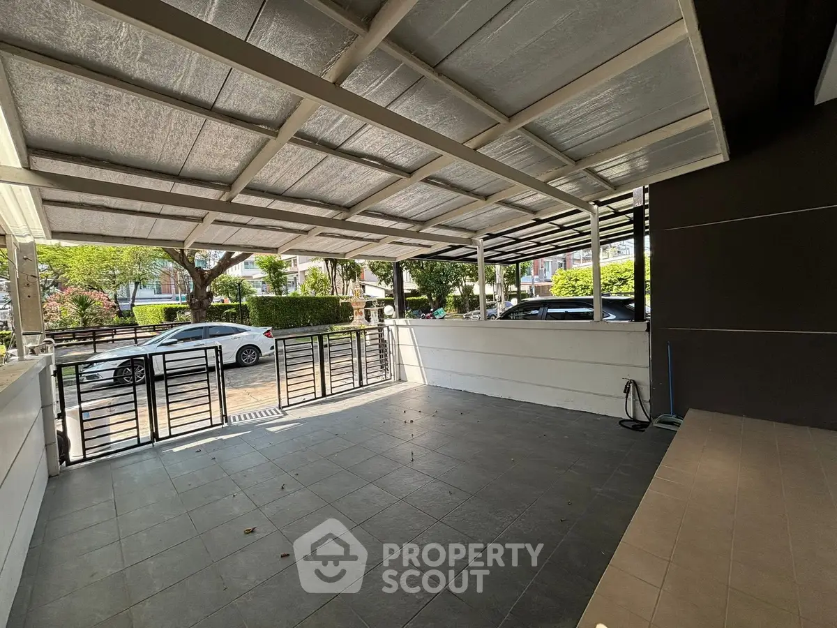 Spacious covered parking area with modern design and street view