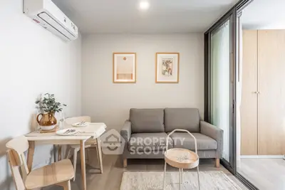 Modern living room with cozy sofa, dining table, and stylish decor in a bright apartment.
