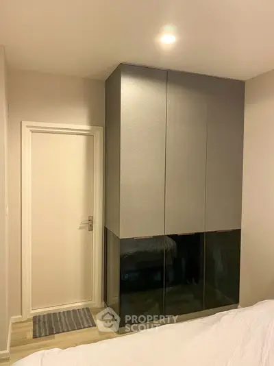 Modern bedroom with sleek built-in wardrobe and minimalist design