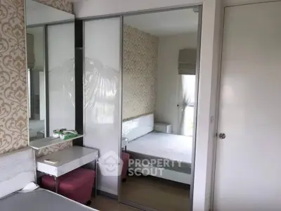 Modern bedroom with mirrored wardrobe and stylish decor