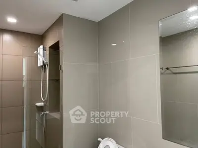 Modern bathroom with sleek tiles and shower area