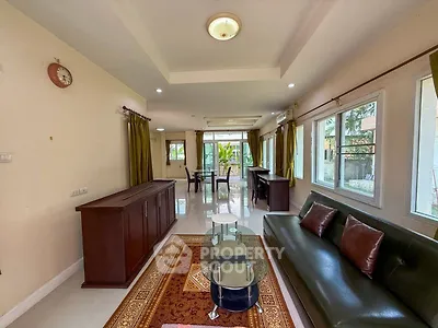 Spacious living room with modern furniture and large windows for natural light.