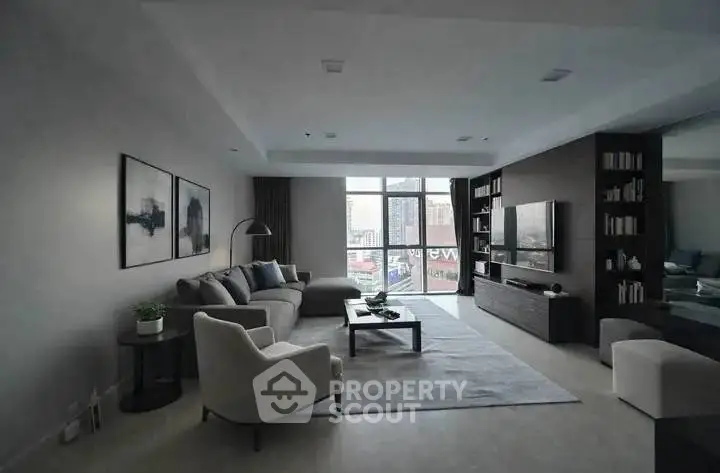 Spacious modern living room with large windows and stylish decor