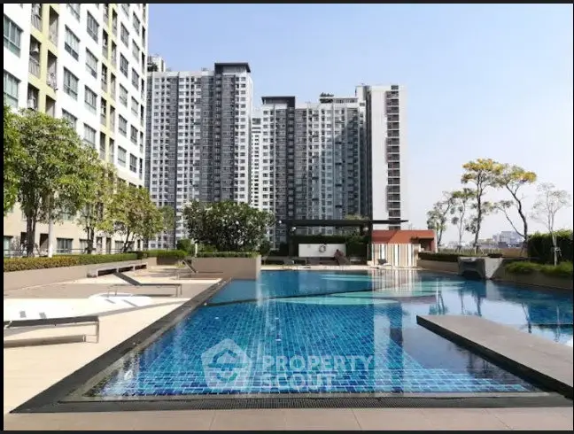 Luxurious condominium with stunning outdoor pool and modern architecture.